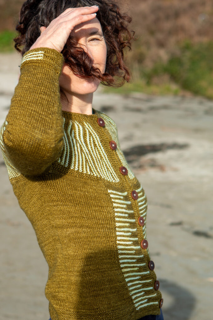 Carol Feller wearing the row by row cardigan in LITLG Sport