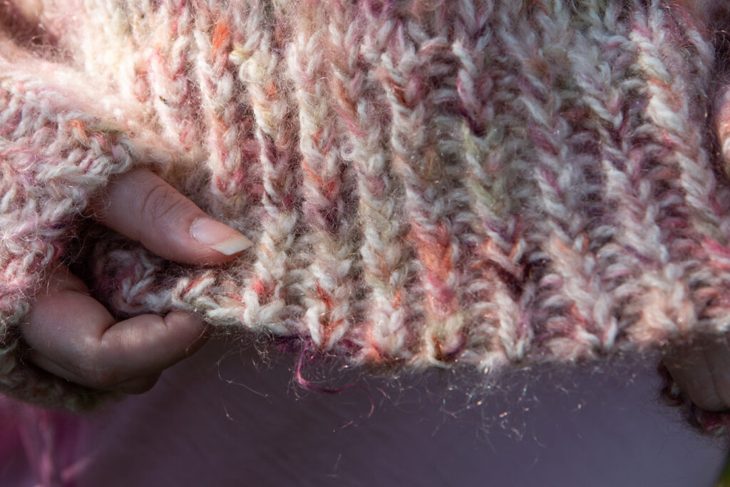 Alternating Twisted Cast on for the Laura sweater using blasta and cowgirl blues fluffy mohair held double. 